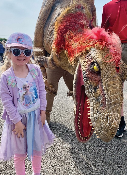 Photo of a girl and dinosaur