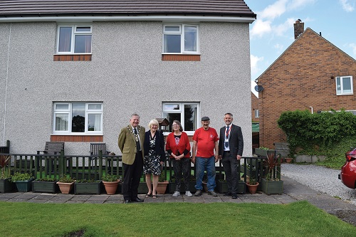Photo of tenants and councillors outside house