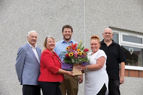 Photo shows councillors presenting Sharon Willoughby with flowers